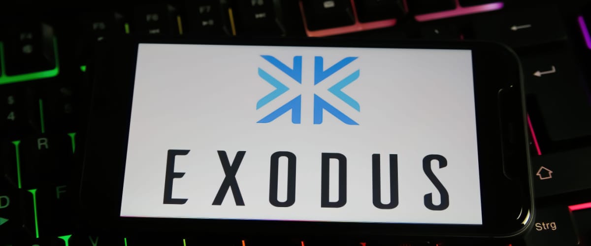 Exodus Wallet card sitting on top of backlit keyboard
